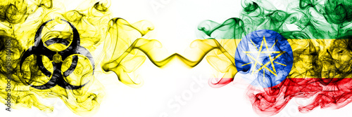 Ethiopia, Ethiopian Quarantine. Coronavirus COVID-19 lockdown. Smoky mystic flag of Ethiopia, Ethiopian with biohazard symbol placed side by side.