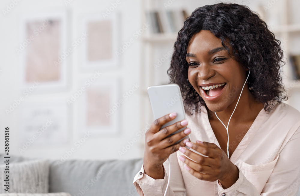 Video call. Cheerful young woman with coffee talking with friends on cell phone, panorama Video call. Cheerful young woman with coffee talking with friends on cell phone, panorama