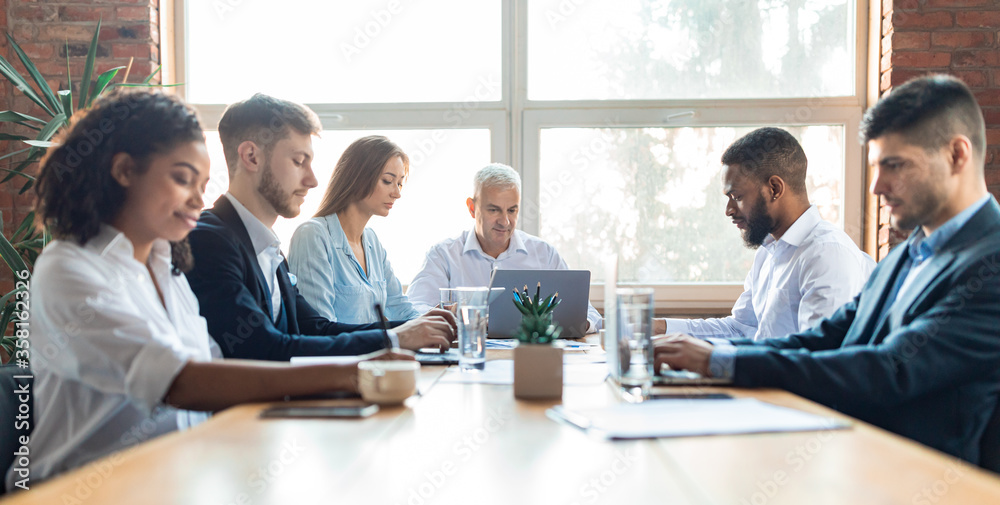 Serious Coworkers Working Sitting At Table In Modern Office, Panorama