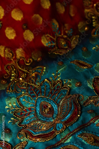 blue-red fabric with golden embroidery. Orient, Indian, Asian, Arabic style