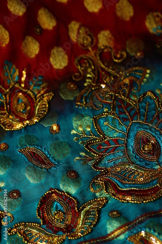 blue-red fabric with golden embroidery. Orient, Indian, Asian, Arabic style