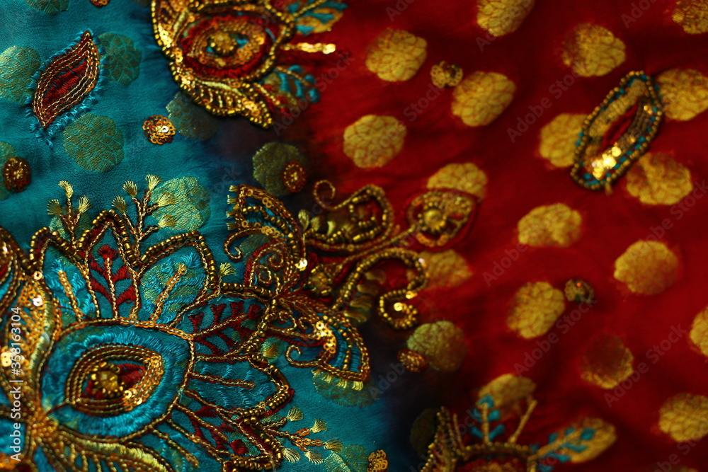 blue-red fabric with golden embroidery. Indian style.