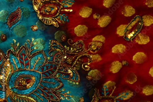blue-red fabric with golden embroidery. Indian style.