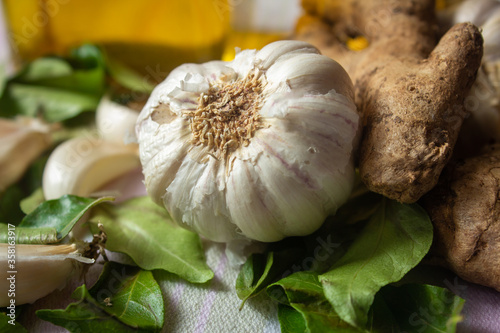 View of commonly used in ingredient (garlic, ginger and curry leaves) in south Indian cooking. Foods that help boost immunity in natural way. photo