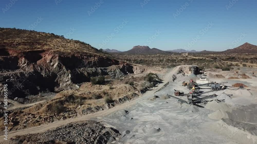4K aerial drone video of African savanna hills, stone quarry near granite boulders range at B1 highway south of Windhoek in central highland Khomas Hochland of Namibia, southern Africa 4K aerial drone video of African savanna hills, stone quarry near granite boulders range at B1 highway south of Windhoek in central highland Khomas Hochland of Namibia, southern Africa
