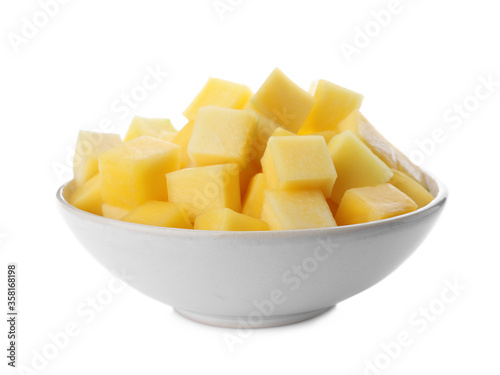 Tasty mango cubes in ceramic bowl isolated on white