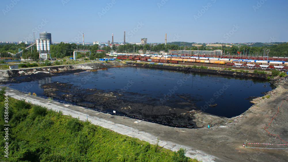 Former dump toxic waste, effects nature from contaminated soil and water with chemicals oil fuel, environmental disaster, contamination lagoon pollution