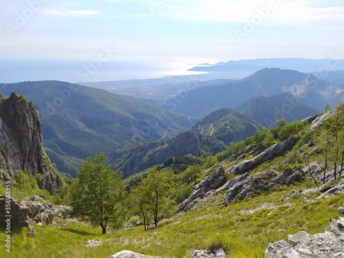 panorama towards the horizon among the wooded valleys on the Apuan Alps of the Tuscan Apennines