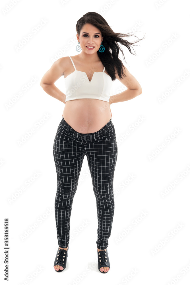 Happy smiling pregnant woman touching her belly isolated on white background. Pregnancy concept studio portrait Mother expecting baby. Baby tea. Happy smiling pregnant woman touching her belly isolated on white background. Pregnancy concept studio portrait Mother expecting baby. Baby tea.