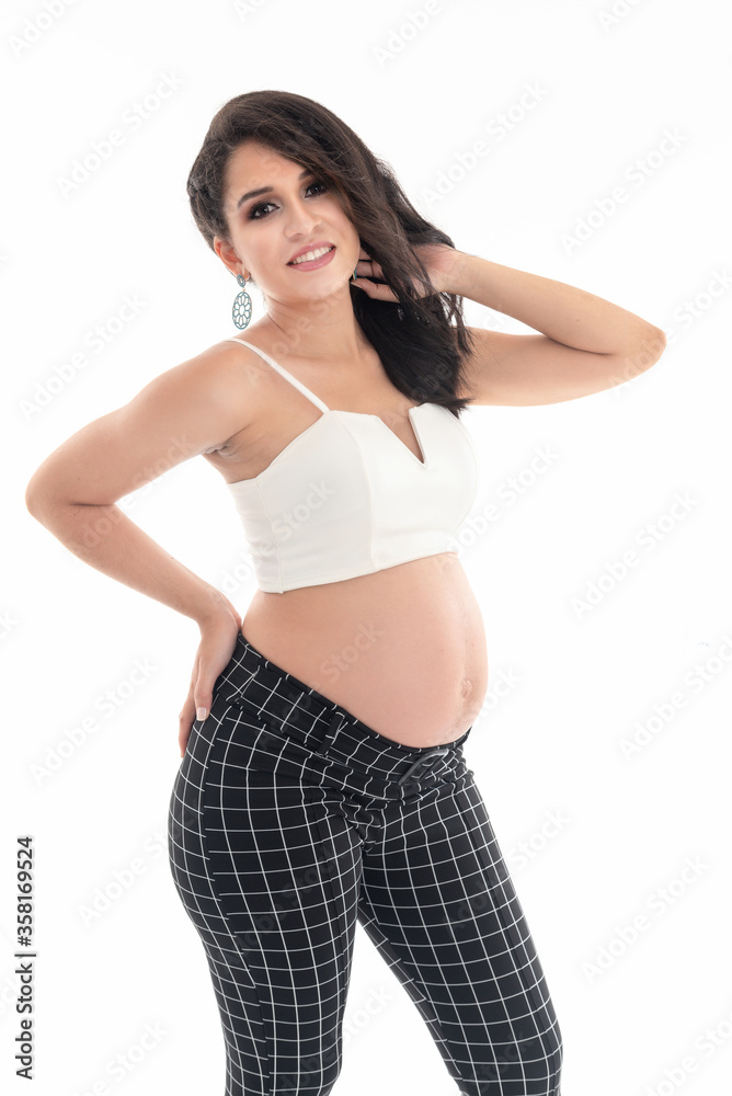 Happy smiling pregnant woman touching her belly isolated on white background. Pregnancy concept studio portrait Mother expecting baby. Baby tea. Happy smiling pregnant woman touching her belly isolated on white background. Pregnancy concept studio portrait Mother expecting baby. Baby tea.