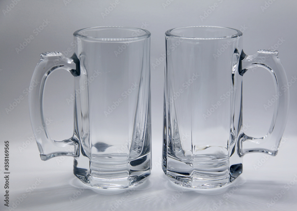 Beer mug, utensil or glass container similar to a glass but with handle, widely used to serve beer, drinks and liquids