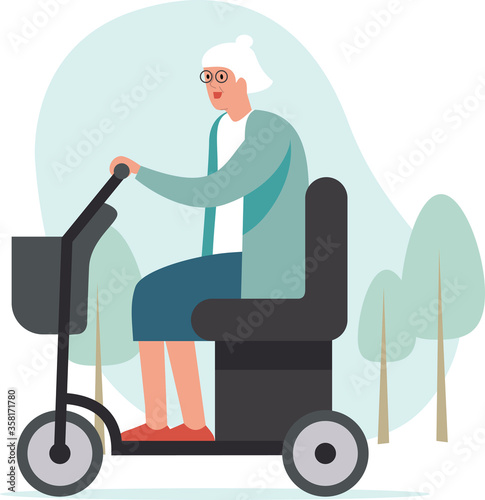 Elderly woman driving mobility scooter. Park area in the background