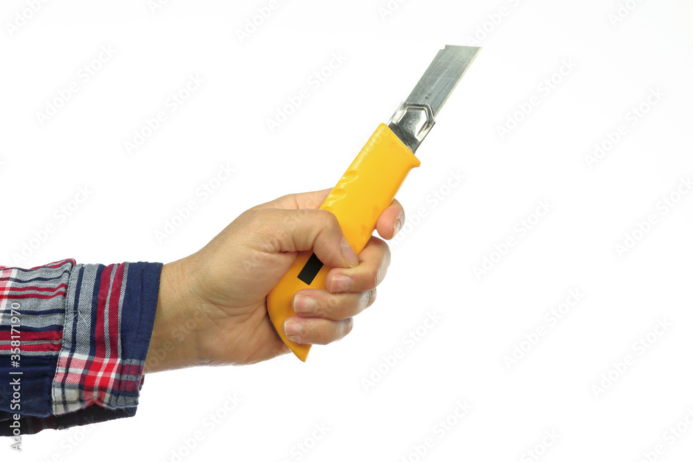 hand and arm of a handyman with a checkered shirt holding a cutter on a white background, iillustration of the concept made by yourself or home made, DIY course hand and arm of a handyman with a checkered shirt holding a cutter on a white background, iillustration of the concept made by yourself or home made, DIY course
