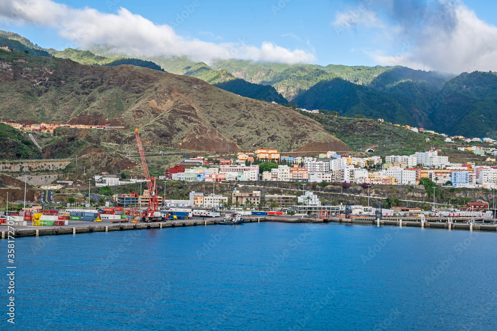 Santa Cruz harbor with a volcano Caldereta and mountains on La Palma, Canary Islands