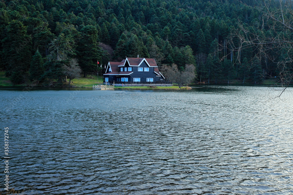 Fototapeta premium Golcuk nature park and a wooden lake house on the shore. Bolu, Turkey