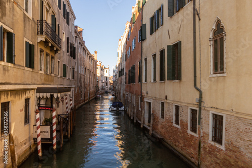 Narrow canal in Venice between two buildings © Melanie