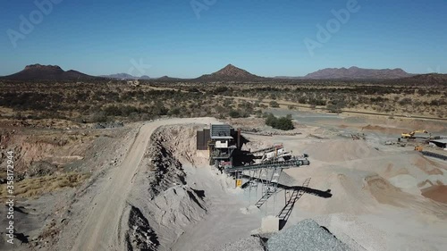 4K aerial drone video of African savanna hills, stone quarry near granite boulders range at B1 highway south of Windhoek in central highland Khomas Hochland of Namibia, southern Africa
