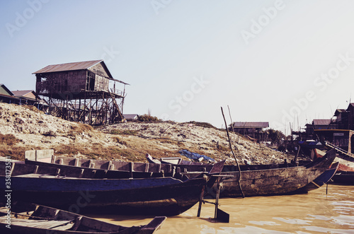 Tonle sap lake houses and boat in Cambodia