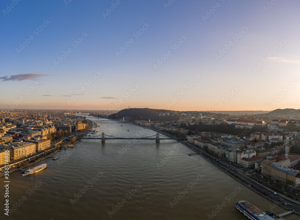 Aerial drone shot of Danube river with chain bridge and Buda Cas