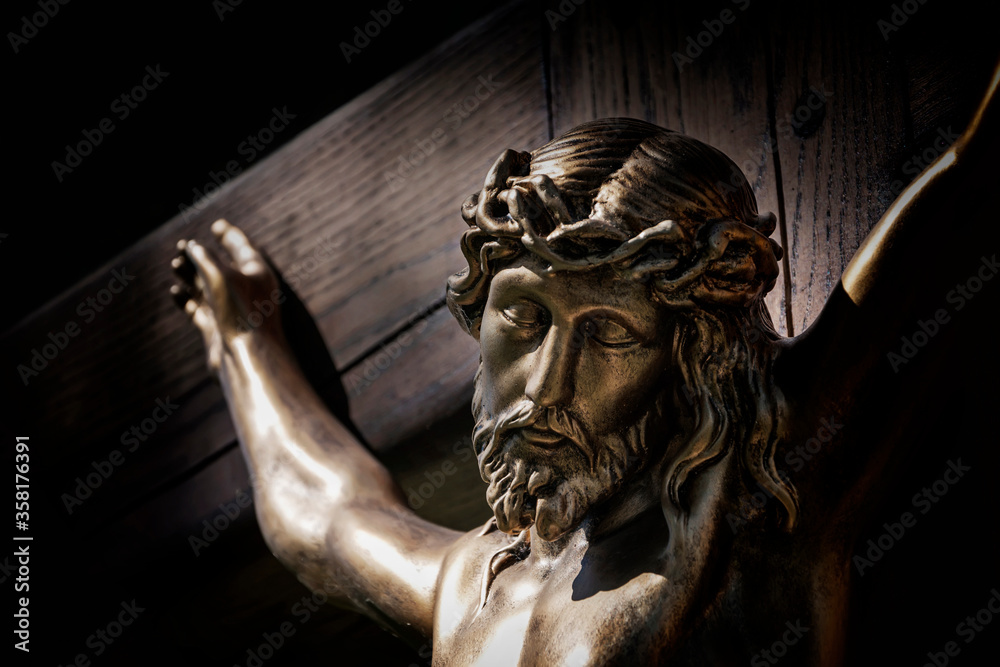 Сrucifixion of Jesus Christ on wooden cross. (concept of self-sacrifice, suffering, faith) Сrucifixion of Jesus Christ on wooden cross. (concept of self-sacrifice, suffering, faith)