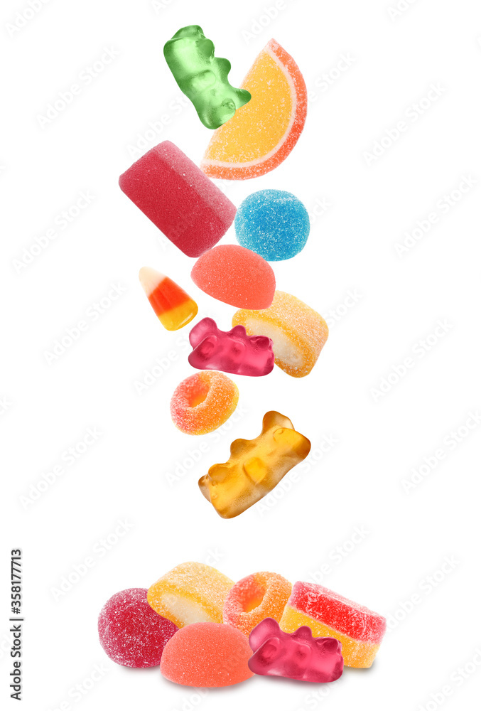 Set of different jelly candies falling into pile on white background Set of different jelly candies falling into pile on white background