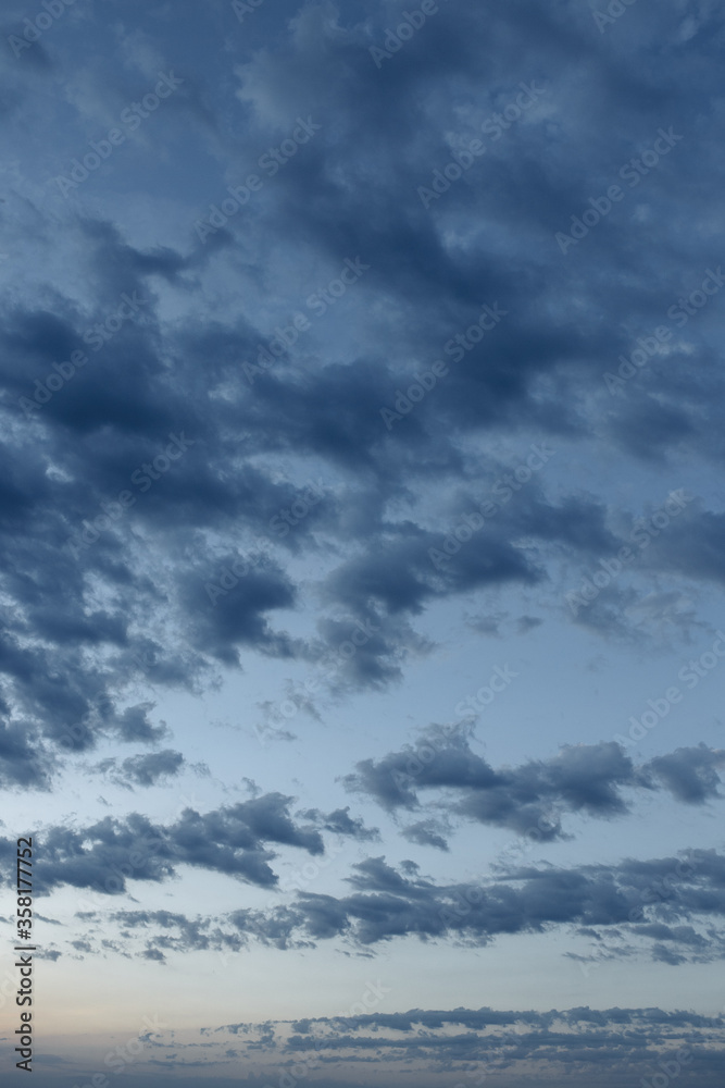 Beautiful evening clouds in blue sky for background.