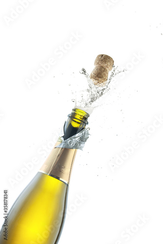 Konstfotografi Opening a bottle of champagne on a white background