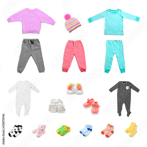 Set with different baby clothes on white background