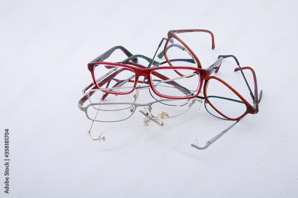 View of used and worn old spectacles on white background. View of used and worn old spectacles on white background.