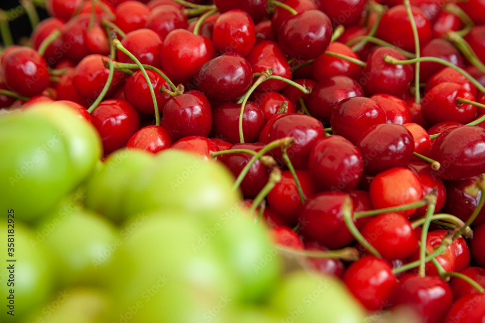 Red sweet cherries in the stock of a market Red sweet cherries in the stock of a market