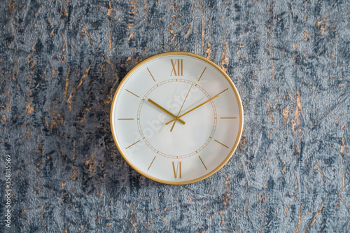 Wallpaper Mural Gold clock on the wall on a homogeneous background Torontodigital.ca