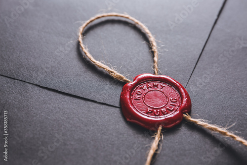 Envelope with notary public wax seal, closeup photo