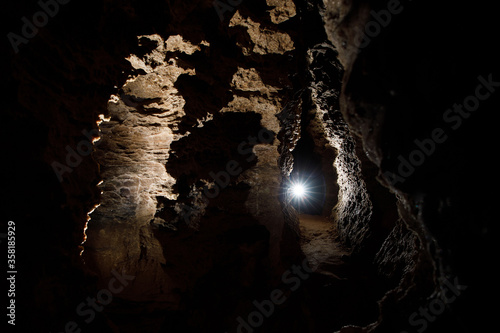 Dark Tunnel Cave has nobody. Tourist route, tours, adventures and interesting places. inside ancient crystal formations, stones, geology, explore of rocks of the soil. village Mlynky . Ukraine photo