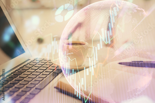 Wallpaper Mural Double exposure of financial chart drawing and desktop with coffee and items on table background. Concept of forex market trading Torontodigital.ca