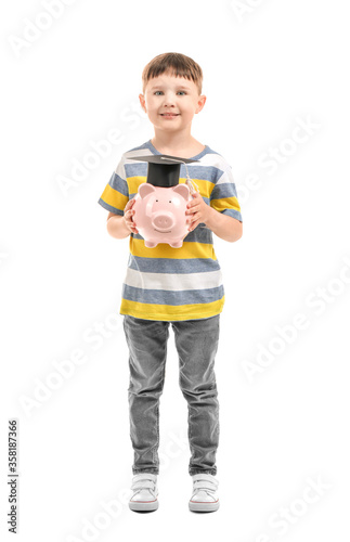 Little boy with piggy bank ...