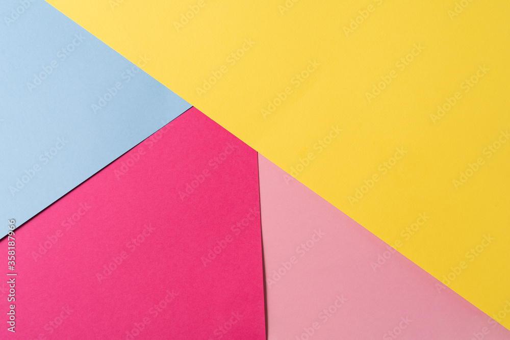 Pink,blue and yellow colored abstract paper , with geometric shape for using as background.