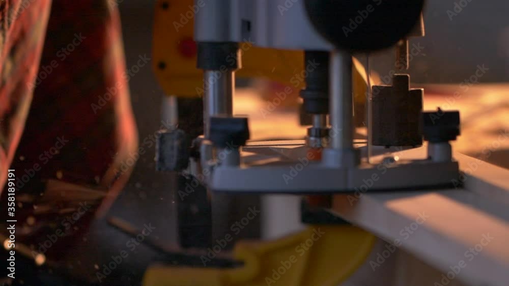 Close-up automatic electro-milling machine. Milling cutter during wood processing. Manual milling cutter. Woodworking tools. Joiner's workshop