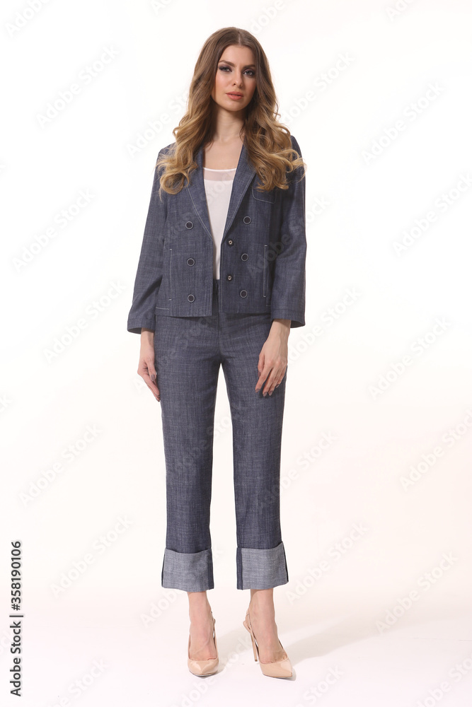 business woman executive posing in denim jeans suit jacket and trousers business woman executive posing in denim jeans suit jacket and trousers
