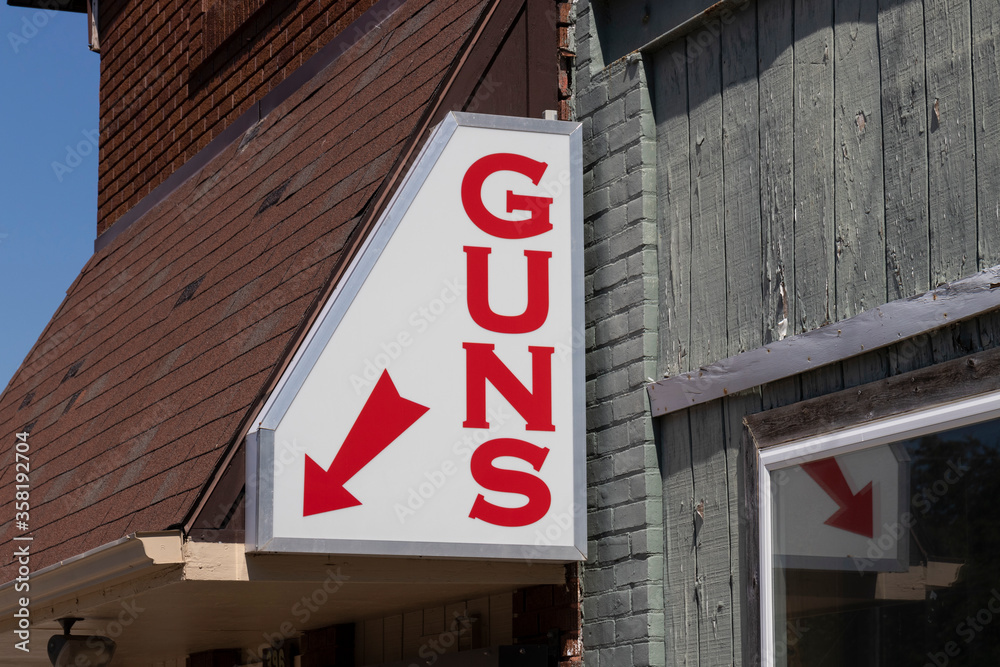 Gun store sign. Gun sales tend to rise as safety concerns spread. Gun store sign. Gun sales tend to rise as safety concerns spread.
