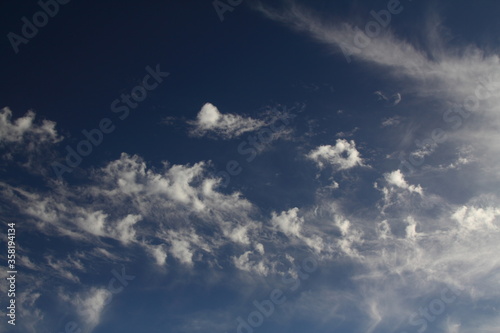 The vast blue sky and clouds sky. blue sky background with tiny clouds. © bt1976