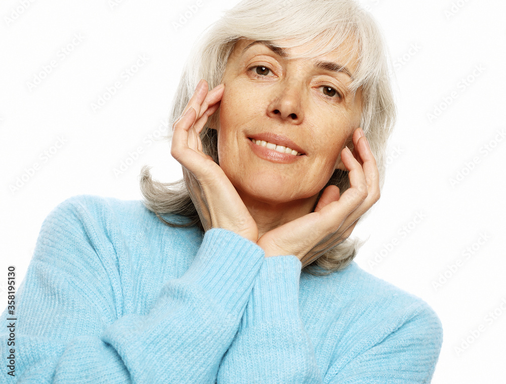 Elderly happy woman wearing blue sweater Elderly happy woman wearing blue sweater