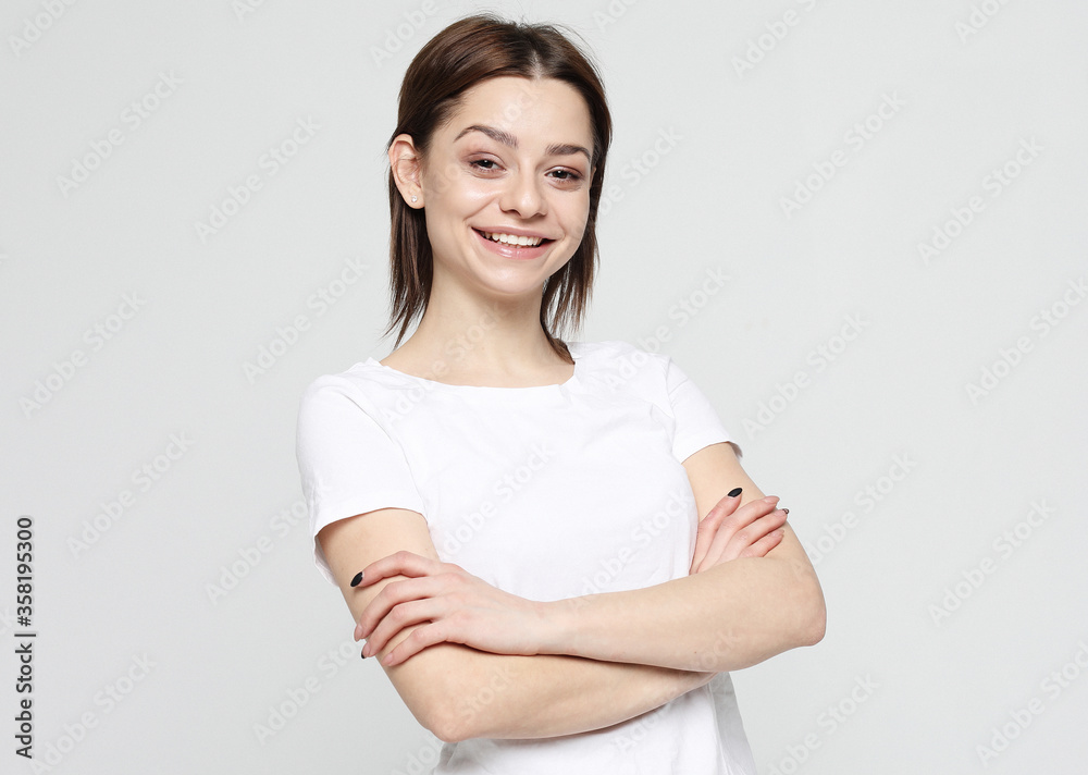 good looking young woman smiles positively good looking young woman smiles positively