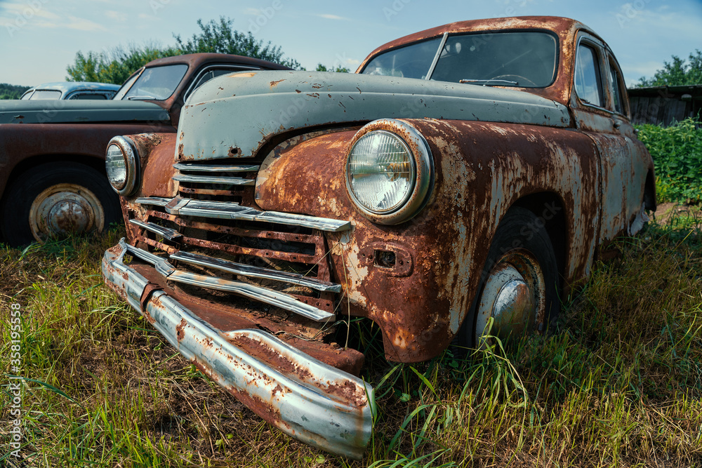 Old retro rusty abandoned and forgotten cars, cemetery of vintage autos. Old retro rusty abandoned and forgotten cars, cemetery of vintage autos.