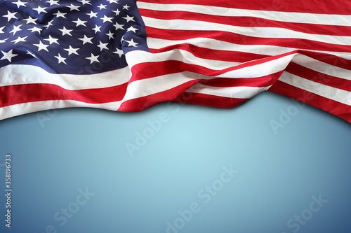 American flag on blue. Copy space