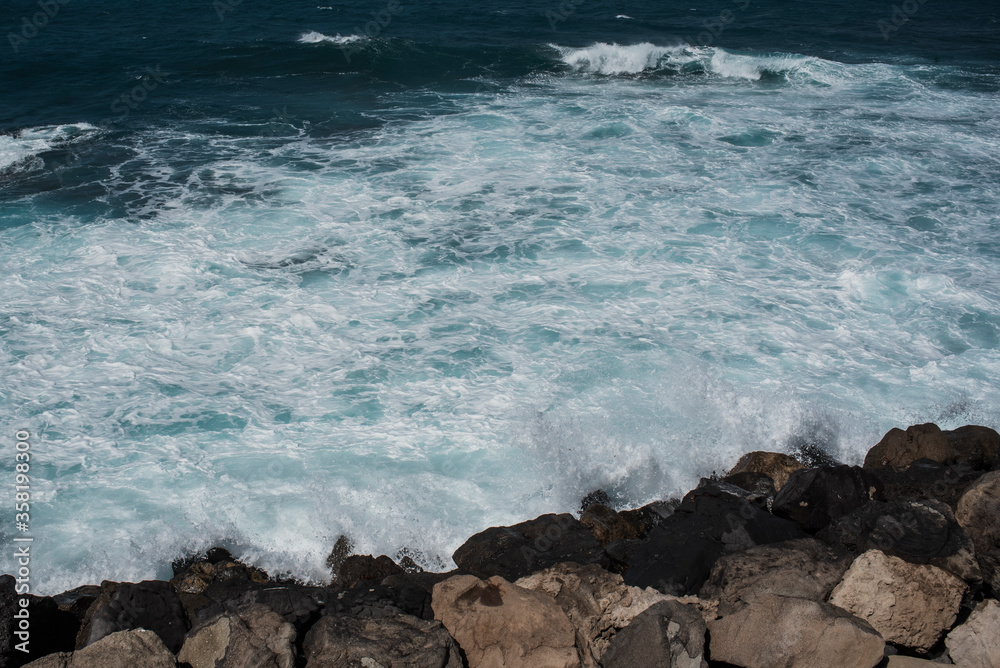 Waves crashing on rocks.