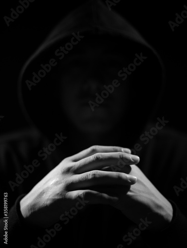 Принти на полотні Low key photography, crossed hands of a raper