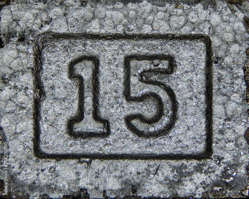 Weight in pounds depicted on a dumbbell