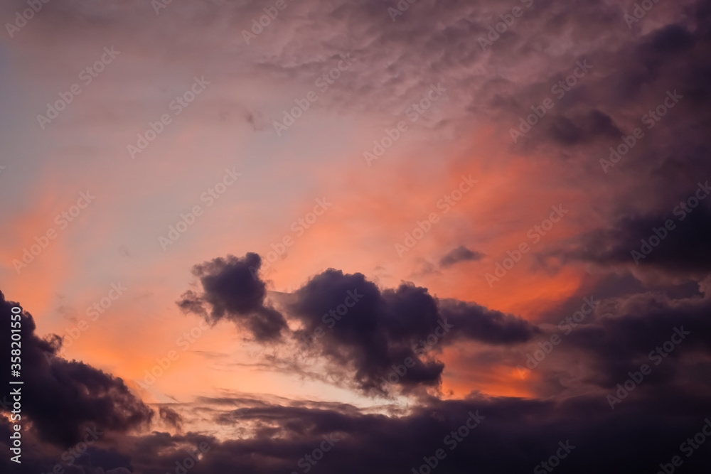 Dramatic sky with dark storm clouds and red sunset clearance
