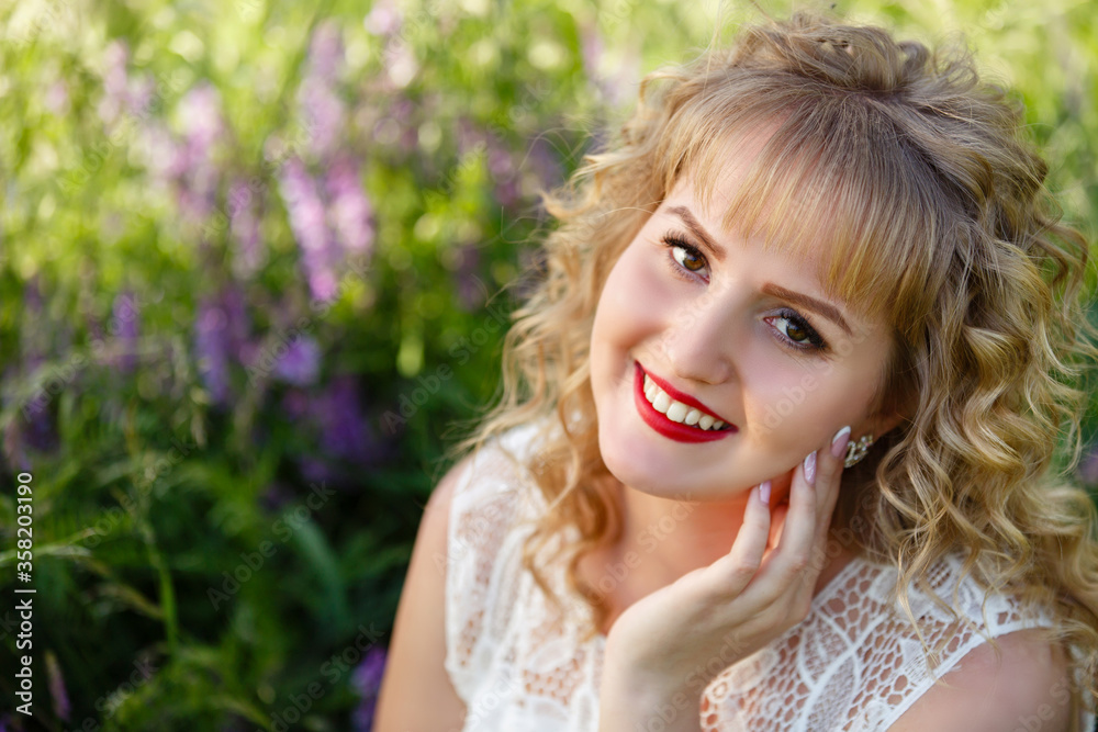 Young woman in blooming near lilac bush in a garden. Spring story. Romantic look with white lace dress. Happy girl in beautiful spring day. Pretty slim blonde woman, caucasian Young woman in blooming near lilac bush in a garden. Spring story. Romantic look with white lace dress. Happy girl in beautiful spring day. Pretty slim blonde woman, caucasian