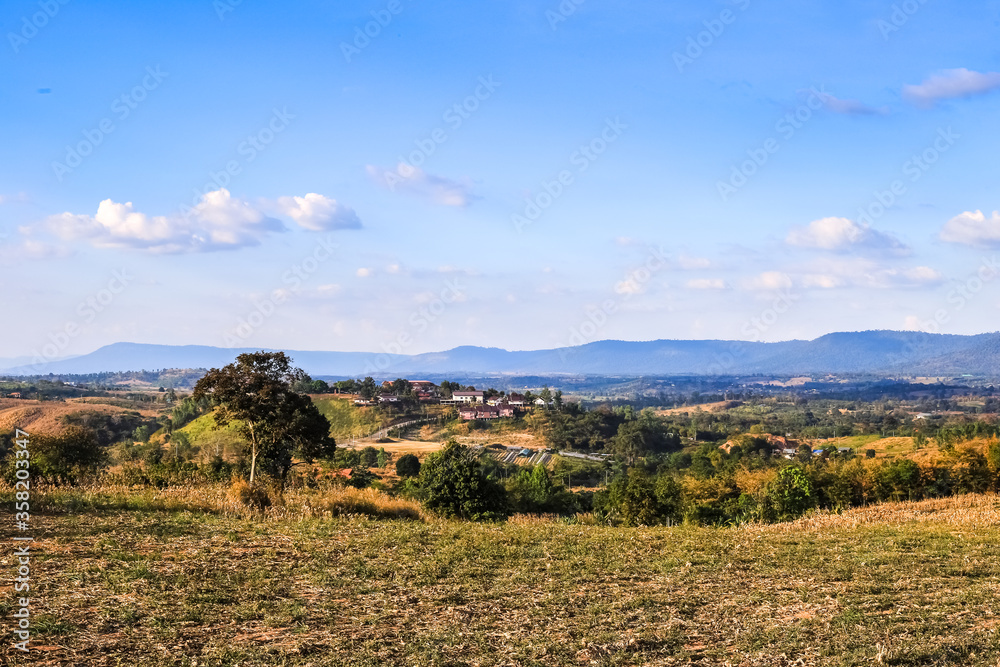 autumn landscape with mountains and blue sky
